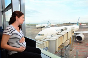 AUCKLAND - APR 10 2014:Pregnant passenger in Airport.Expectant Mothers, till the end of 35 weeks of pregnancy may be permitted to fly on Jet Airways flights provided there are no prior complications.